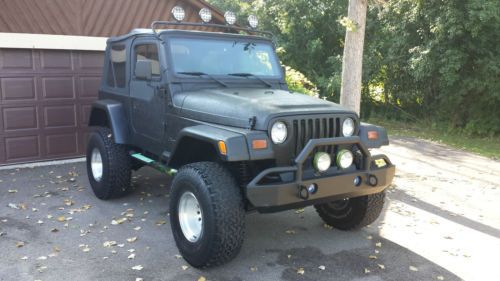 Buy used Black Custom Rhino Lined and lifted 1997 Custom Jeep Wrangler