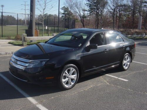 2012 ford fusion se sedan 4-door 3.0l flex fuel midnight black on black cloth