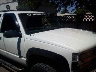 White 94 chevy surburban. runs good,straight body,