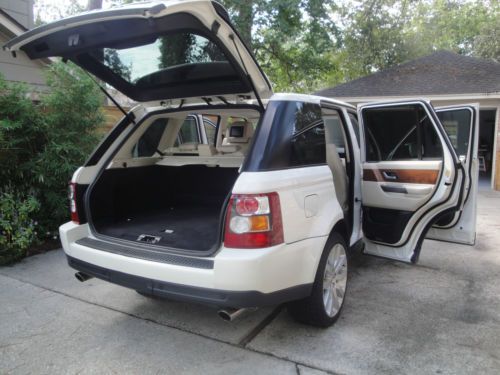 Supercharged built in video in headrests    white with white leather interior