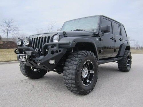 Unlimited mercenary 4" lift fastback top w/ dual sunroofs loads of extras!