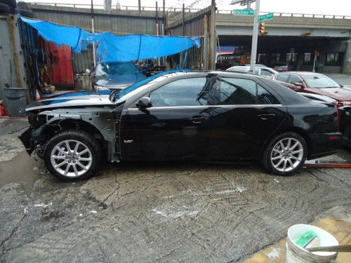 2009 cadillac sts-v - light front-end damage - clean title - runs/drives!