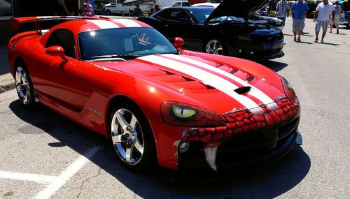 2009 dodge viper coupe. 650 hp. bright orange with white stripes. custom paint