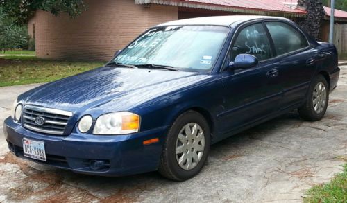 2004 kia optima 4 door sedan, 4 new tires, 27 highway mpg - very dependable