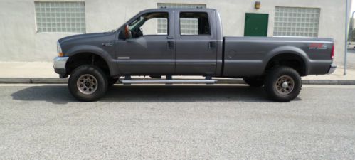 2004 f-350 super duty truck, 4 door, 6.0 turbo diesel , 8 ft. bed 4 x 4 lifted