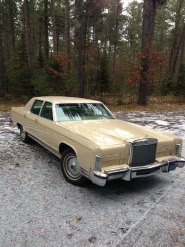 Tan 4 door hard top sedan