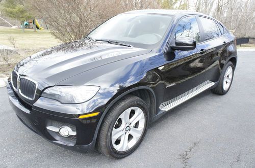 2010 bmw x6 xdrive35i black loaded,  still under manufacturers warranty