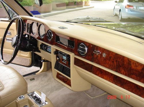 Black rolls royce silver spur 4 door formal sedan with tan interior