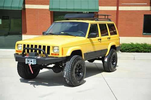 Jeep cherokee sport xj / lifted / new lift, tires, wheels, safari rack, line-x
