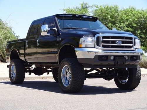 No reserve 2002 f-250 4x4 crew cab 7.3 liter turbo diesel lifted tv's dvd