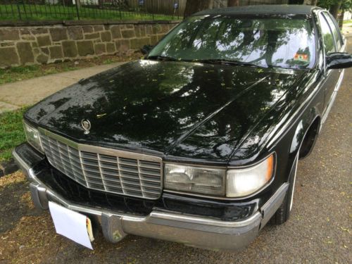Black cadillac fleetwood brougham very well kept condition