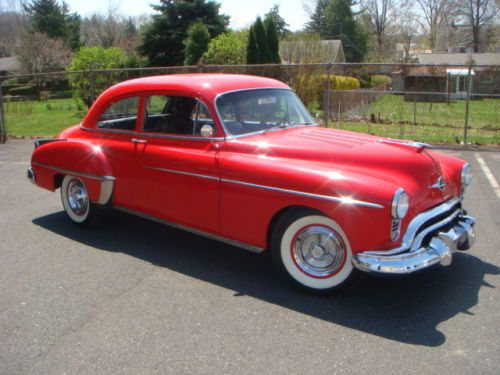 Oldsmobile rocket 88, porshe red, mcculloch super charger