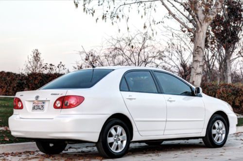 2005 white toyota corolla le clean