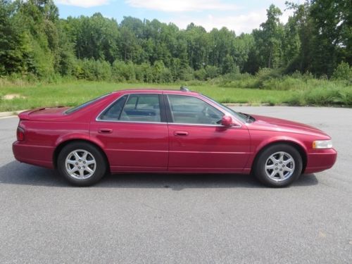 1999  seville sts high bidder wins auction