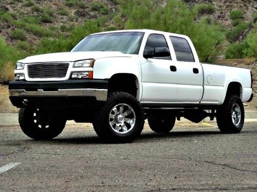 No reserve 05 chevy 2500hd 4x4 6.6l duramax diesel fabtech lift tv/dvd warranty