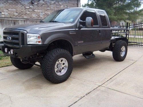 F250 superduty 4x4 custom air suspension lifted flat bed