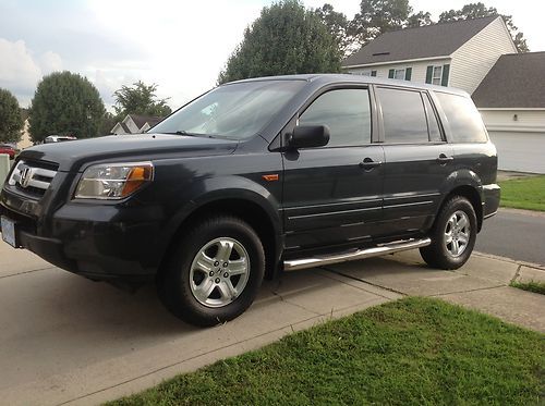 A~no 2006  4x4 8 pasajeros, dvd ,grey color, 91.000 millas.