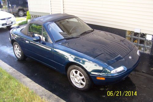 Blue convertible 2 seat  mazda miata mx-5