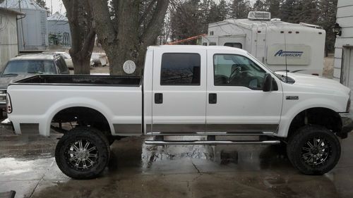 2003 f250 xlt 4 door 4x4 6.0 powerstroke lifted with 20" rims