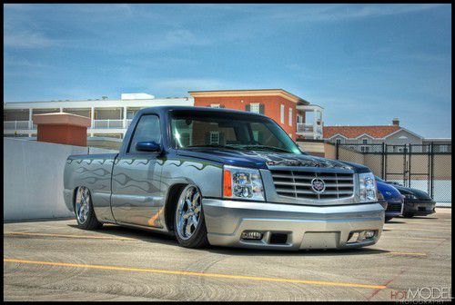 2000 custom silverado with escalade front clip, air ride, shaved, custom audio.