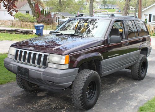 Super clean, dark purple, 60k on motor, low reserve, 4wd, suv, lifted