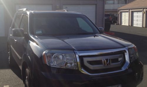 2009 honda pilot touring 4wd 5d 20k or best offer