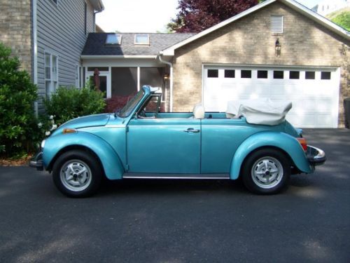 Beautiful river blue metallic convertible w/ white top