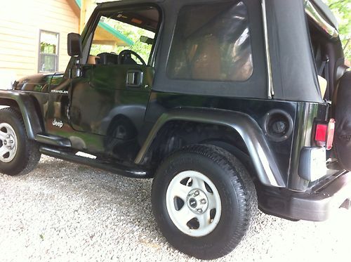 "98 jeep wrangler new tires battery lo mi.ac tilt cruis 5 spd black