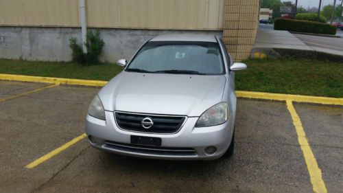 2003 nissan altima se sedan 4-door 3.5l no reserve..  look