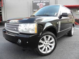 Supercharged look*nav*20" s/c wheels*carfax cert*we finance*h/k*heated seats*fla