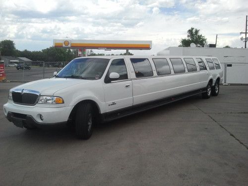 Tandem rear lincoln navigator. 20 passenger. white limousine call 720-329-4349