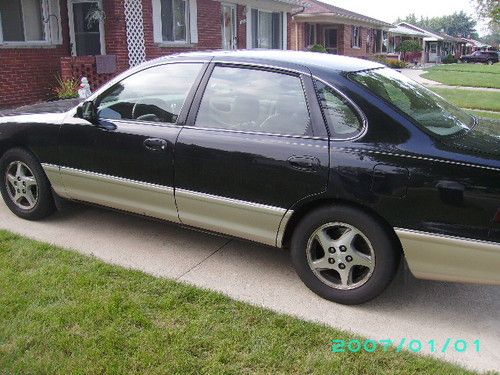 1999 toyota avalon xls 4 dr sedan black w/beige leather interior  runs excellent