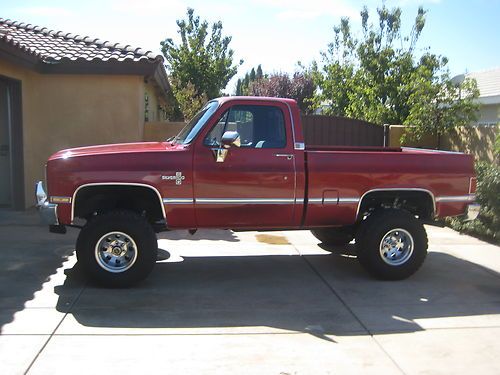 1987 red chevy silverado 1/2 ton short bed pick-up