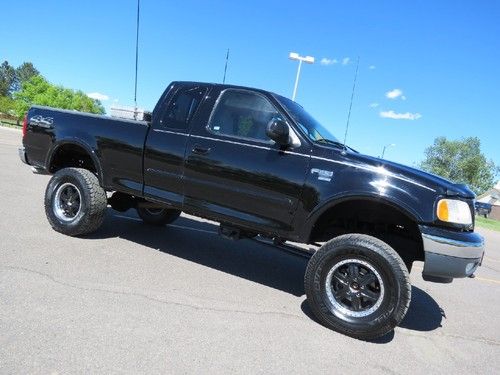 2000 ford f150 supercab 4x4 lifted custom 35" tires 5.4 v8 xlt runs great ! 6ft