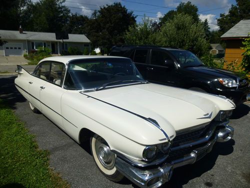 White 4-door 1959 cadillac deville