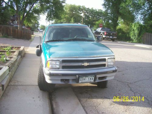 Tranny out but rest of teal colored blazer in decent condition. 4 w/d 4 door