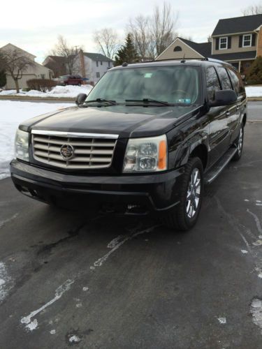 2004 cadillac escalade ext black with beige interior, video entertainment system