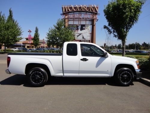 Automatic extra cab truck with a tonneau cover