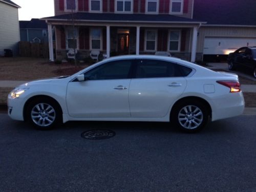 9 month old altima white 4 drs