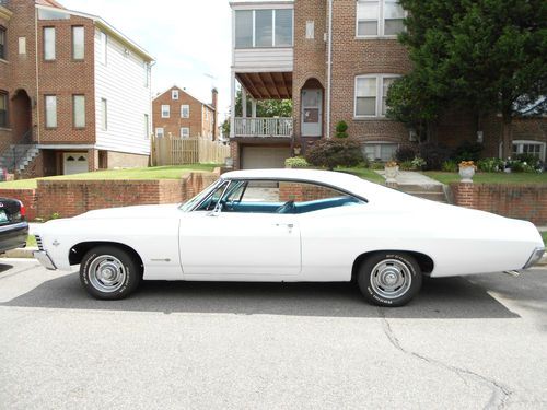 1967 chevy impala ss 2dr hardtop with bucket seats and center console.