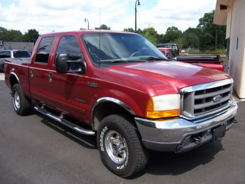 2001 ford f250 crew cab lariat 4x4...7.3 turbo diesel...2 owner..nice truck.....