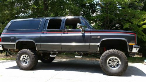 Lifted 1987 gmc suburban, new wheels and tires, no rust and low miles