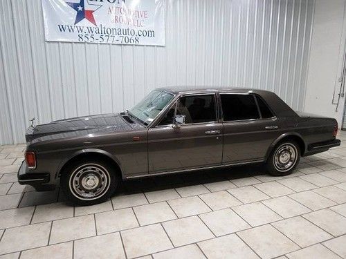 Silver spirit, gray, power brakes,power windows,power locks,wood trim