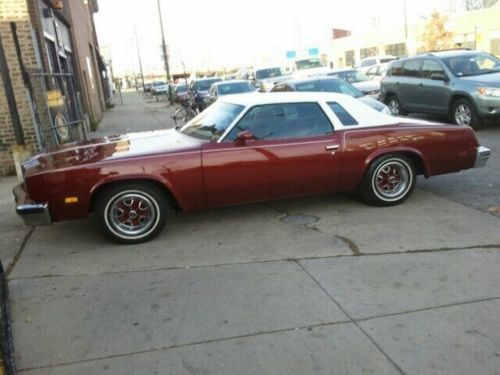 Restored burgundy 1976 cutlass