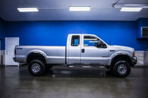 Lifted 7.3l powerstroke diesel running nerf bars tow pkg power locks &amp; windows