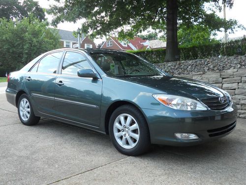 2003 toyota camry xle sedan 4-dr 6 cyl with leather power seats very many extras